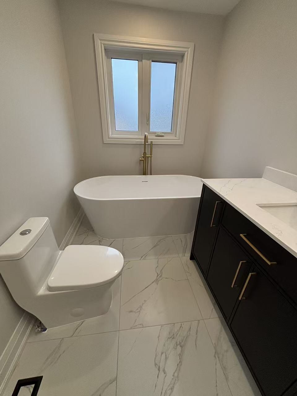 Custom bathroom storage cabinetry and quartz top
