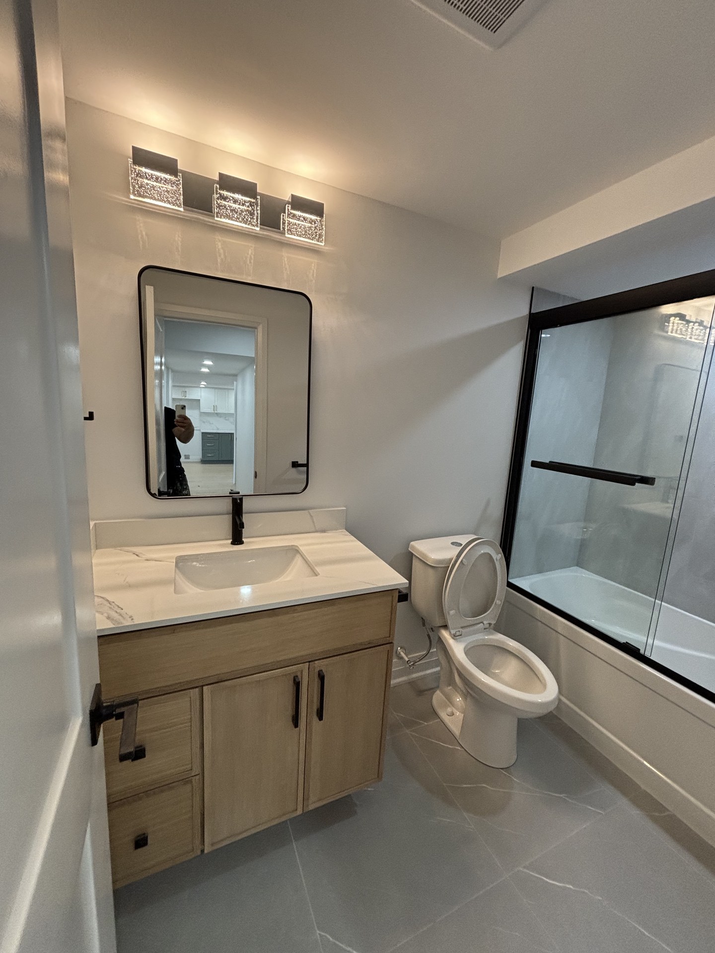 Custom bathroom lighting and mirror installation